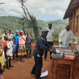 VIVAA distributes School Items like exercise books, text books to pupils in a remote primary school in Kumbo